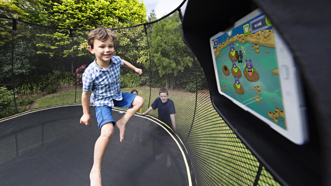 A child playing on one of the Springfree trampolines (
