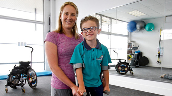 Austin Manning with his physiotherapist Amanda Meys at Avenues Physio-Fitness where he had been strengthening his limbs for his operation (Ruth Keber).