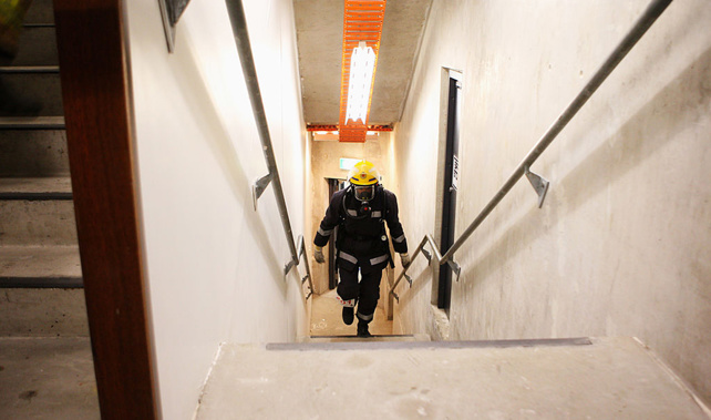 A firefighter races up the steps of the Sky Tower (Getty Images)