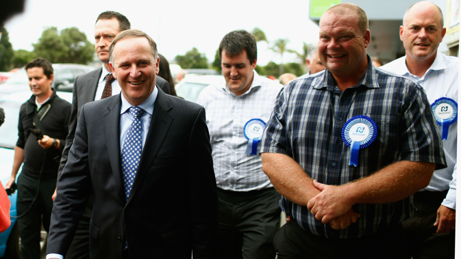 Prime Minister John Key speaks with locals during a walkabout with the National Party candidate for Northland Mark Osborne in 2015 (Photo / Getty Images)