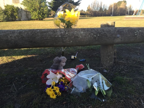 Flowers and toys have been laid at Cowles Stadium car park in Christchurch where a two-year old boy was run over and killed last night. (Kurt Bayer)