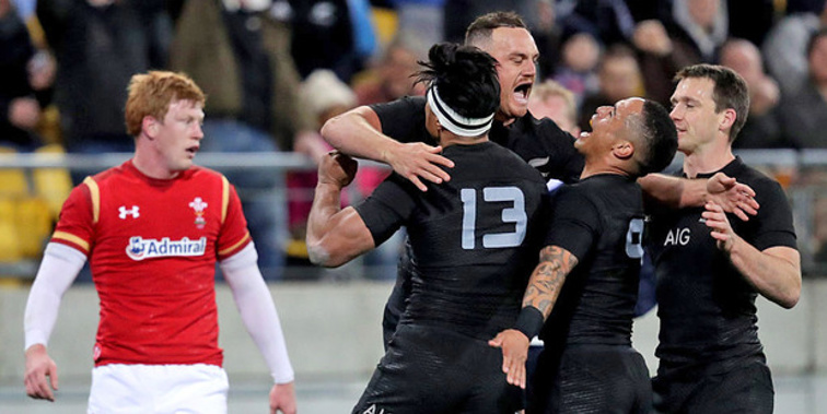 Israel Dagg celebrates with teammates after scoring the opening try in the second test between the All Blacks and Wales. (NZ Herald/Getty Images)