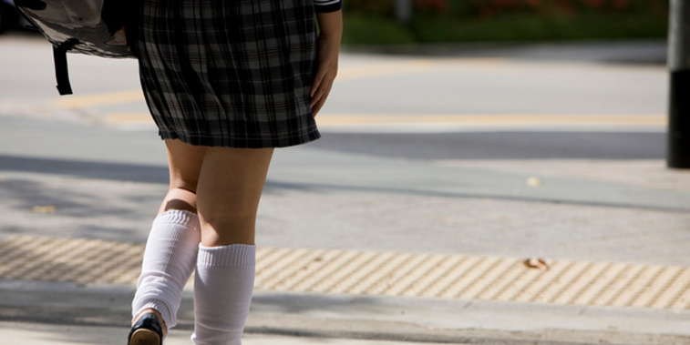 A female student on the way to school. Students told about the short skirt issue became emotional.