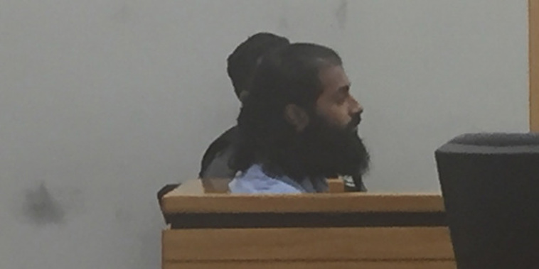 Niroshan Nawarajan in court sentenced to home detention for possessing terrorist material. (NZ Herald/Rob Kidd)