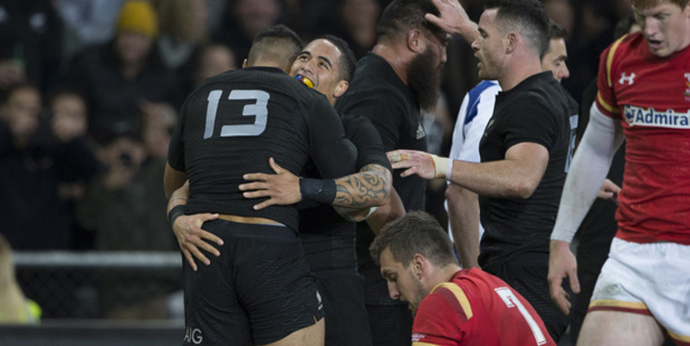 Aaron Smith celebrates with George Moala after the All Blacks centre scored in the third test win over Wales. (NZ Herald/Brett Phibbs)