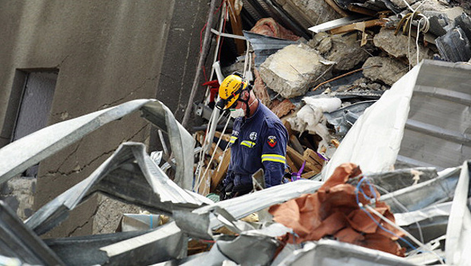 A rescue worker in the rubble of the CTV building (Getty Images)