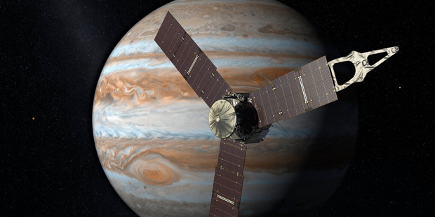 NASA renderings of the Juno spacecraft near Jupiter. Photo / AP / NZ Herald