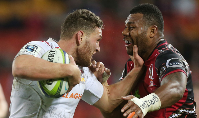 Tawera Kerr-Barlow fends off a Reds player (Getty Images)