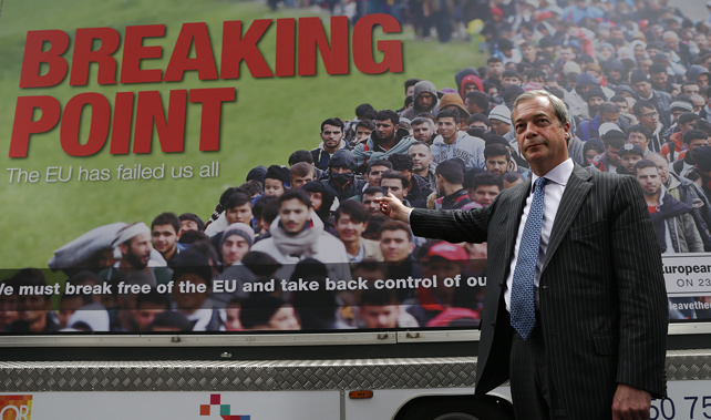 Former UKIP leader Nigel Farage stands in front of an inflammatory poster during the Brexit campaign (Getty Images)