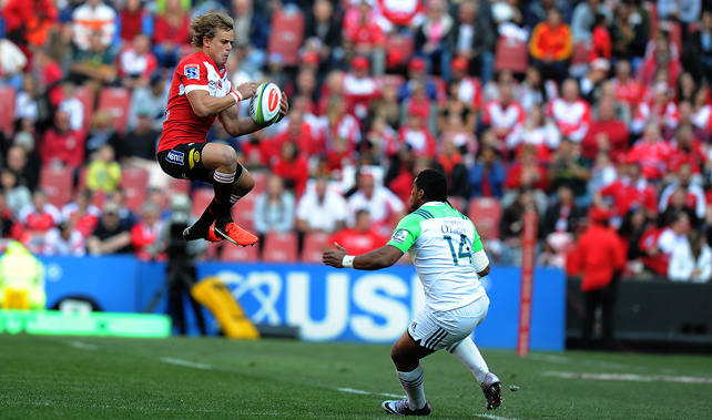 Andries Coetzee jumps with the ball past Waisake Naholo (Getty Images)