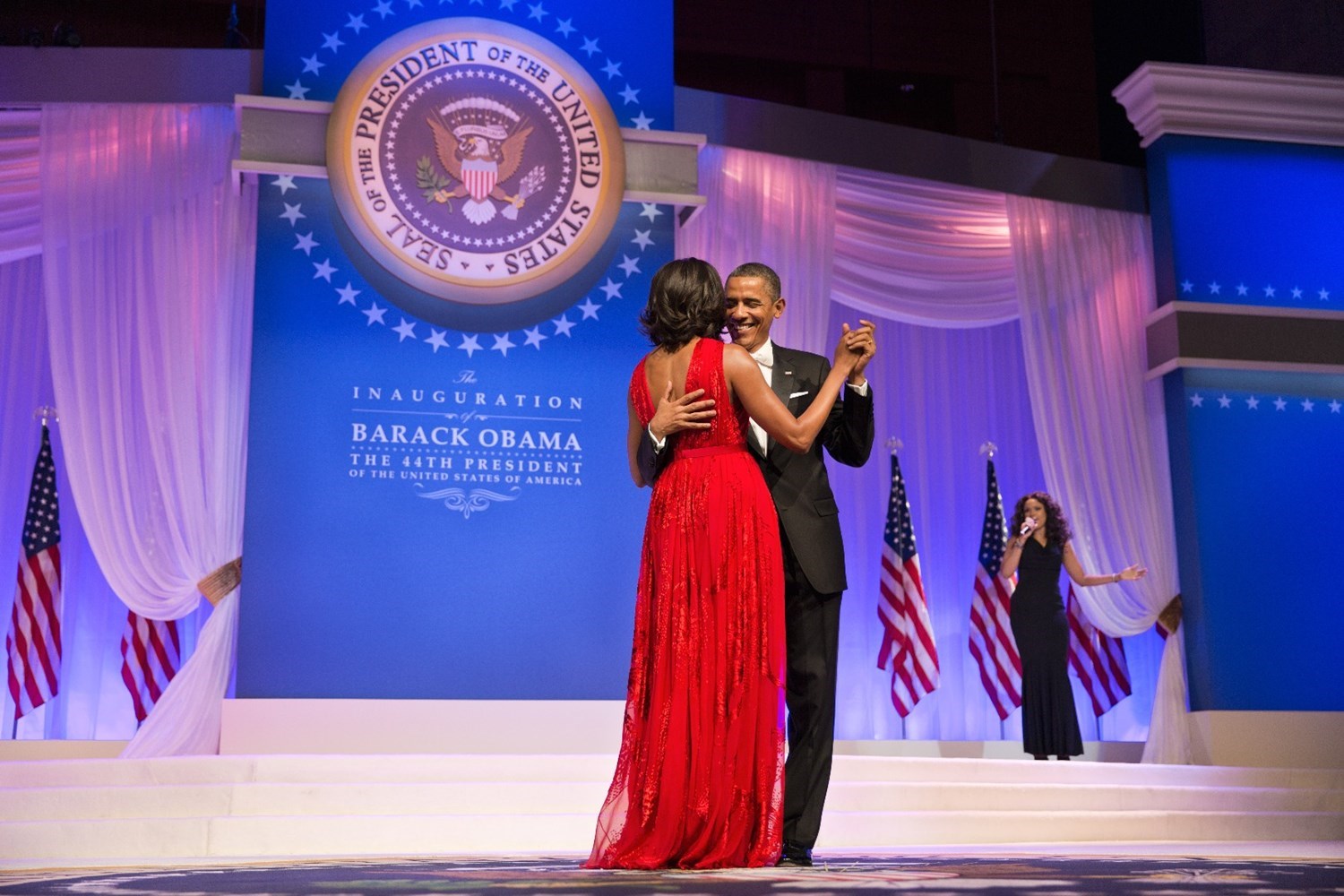 President Barack Obama and First Lady Michelle Obama dance at the Commander in Chief Ball at the Walter E. Washington Convention Center in Washington, D.C., Jan. 21, 2013. The President and First Lady danced to "Let's Stay Together" performed by Jennifer Hudson, right.