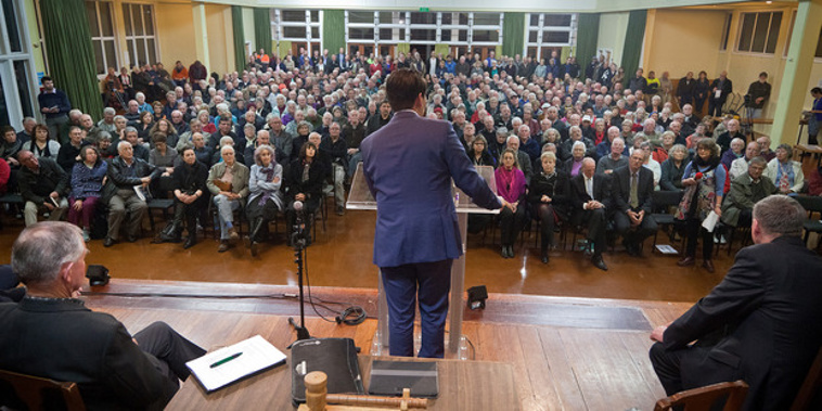 Transport Minister Simon Bridges speaks to about 400 people gathered in Katikati. Photo / Andrew Warner