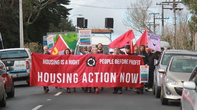 Around 12.30, they marched down St Johns Rd towards the open homes. 