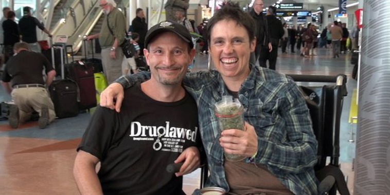 Arik Reiss and Rebecca Reider at Auckland International Airport with Reider's medicinal cannabis prescription, which she brought through customs (Druglawed/Facebook)