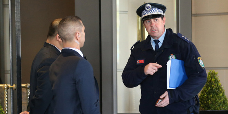A policeman speaks to hotel security outside the Intercontinental Hotel, where the All Blacks are staying ahead of their test (NZ Herald)