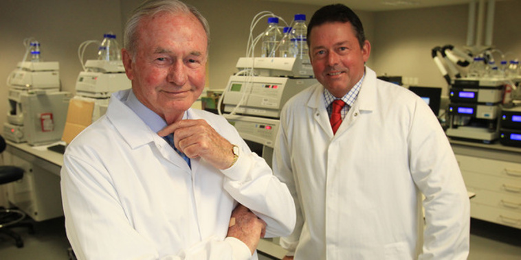 Sir Graeme Douglas with his son Jeff in one of the labs at Douglas Pharmaceuticals in Henderson, Auckland. File photo / Greg Bowker