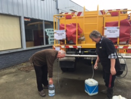 Pahiatua residents replenish their fresh water supplies at a tanker parked in town. (Georgia Nelson)