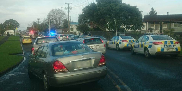 Police at the scene in Glen Eden. Photo / Renee Wells