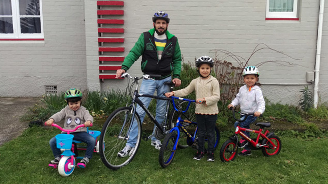 The El-Masri family, Moustafa, (4) father Mounir El Masri, Nagham (7) and Baraa (5) (Supplied)