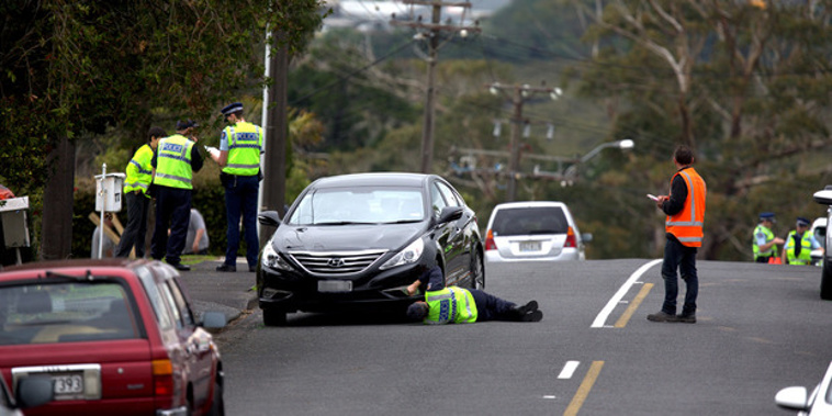 Police at the scene of Jaemont Road, Te Atatu after a child was hit by a car (Dean Purcell)