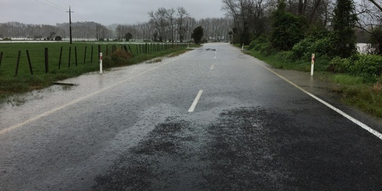 Flooding on the Hikuai Settlement Road out of Pauanui. (NZ Herald/Anna Poulgrain)