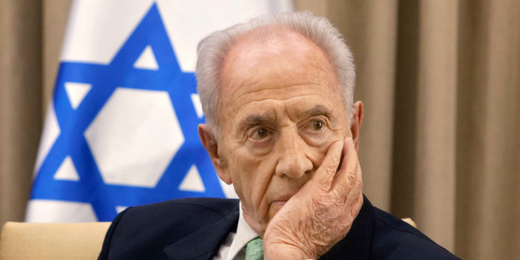 Former Israeli President Shimon Peres, listens during a meeting at the president's residence in Jerusalem. Photo / AP / NZ Herald