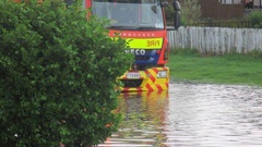 Emergency services make their way through floodwater in Huntly. (Supplied)
