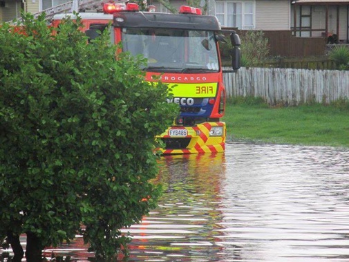 Emergency services make their way through floodwater in Huntly. (Supplied)