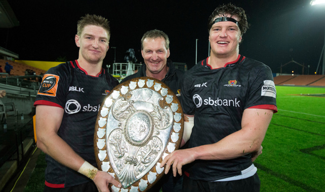 Jordie Barrett and Scott Barrett with their father and the Ranfurly Shield (PHOTOSPORT) 