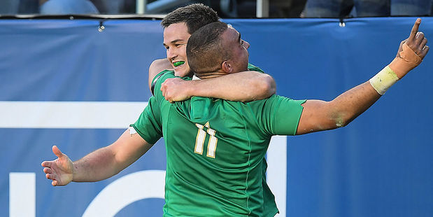 Simon Zebo celebrates with team-mate Jonathan Sexton after scoring their side's fourth try against New Zealand. (NZH/Getty Images)