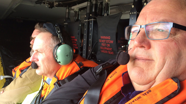 John Key and Gerry Brownlee flying over earthquake damage (Supplied).