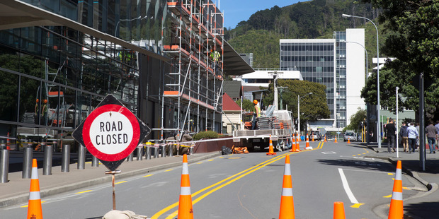 Scaffolding being erected on the exterior of the GCSB and SIS building in Wellington due to damage from the November 14 Kaikoura earthquake. Photo / Mark MItchell