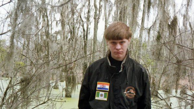 Dylann Roof seen before the killings, wearing a jacket bearing the flags of apartheid South Africa and Rhodesia (Supplied) 