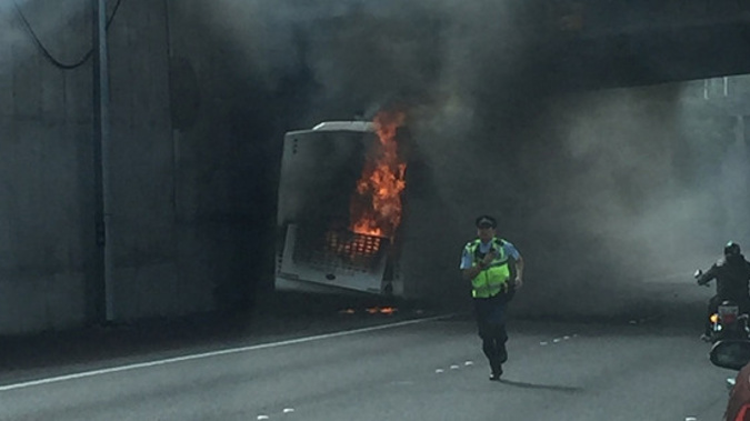 Bus fire at Greenlane interchange. (NZ Herald/Supplied via H. Baker)
