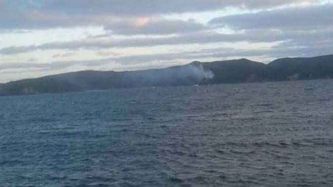 Helicopters worked to put out a fire at Vivian Bay, Kawau Island (Facebook)