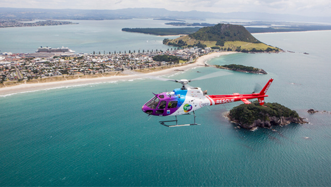 A rescue helicopter in the Bay of Plenty has saved those on board an overturned boat. (Supplied)