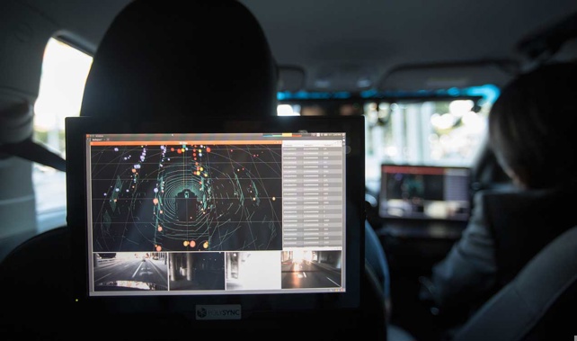 On board with a testing model of a driverless car (Getty Images)