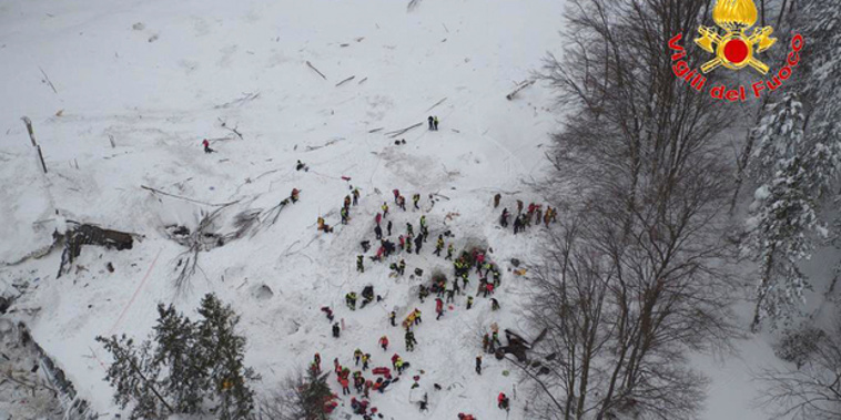 Rescuers have been working amidst snow and debris at an hotel that was hit by an avalanche, in Rigopiano, central Italy. Photo / AP