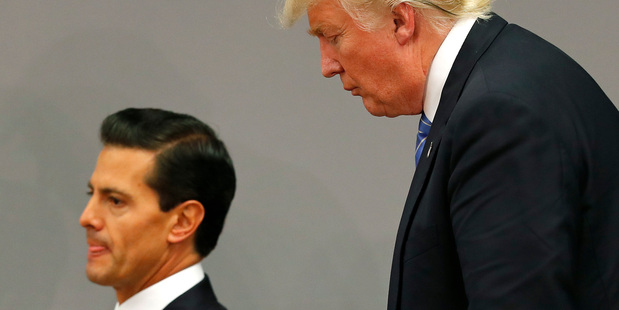 US President Donald Trump with his Mexican counterpart Enrique Pena Nieto last year during a trip to Mexico (Getty Images)