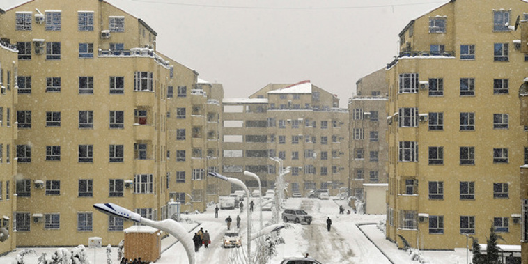 Residents navigate icy streets during a snowfall in Kabul, Afghanistan, today. (AP)