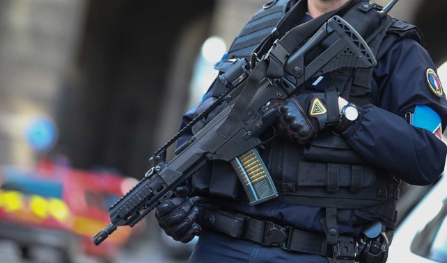 Armed police stand guard at the Louvre in Paris (Getty Images) 