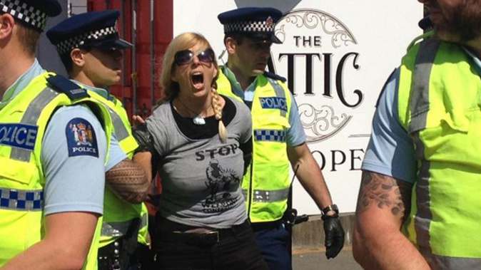Weapons conference protester (@peaceActivismWGTN).