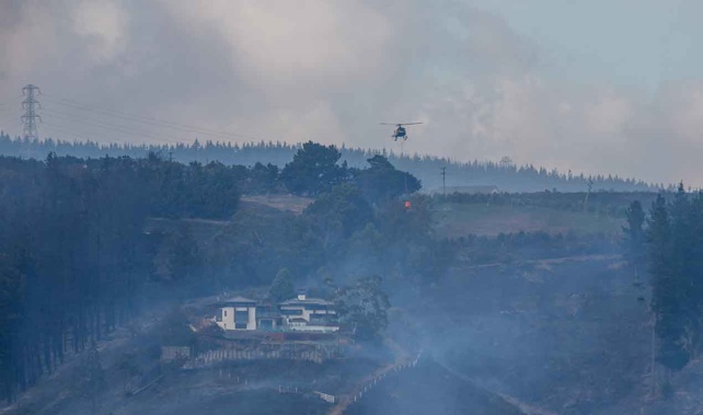 A helicopter battling the blaze earlier this week (Getty Images) 