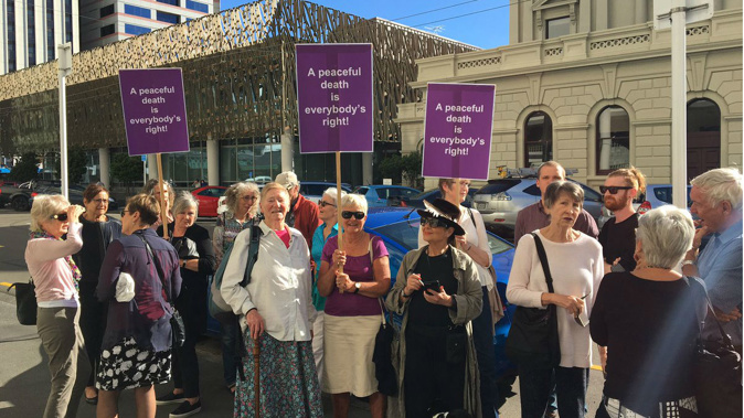 Euthanasia advocates are protesting outside the Wellington District Court, in support of one of their members about to face a judge. (Photo/Georgia Nelson)