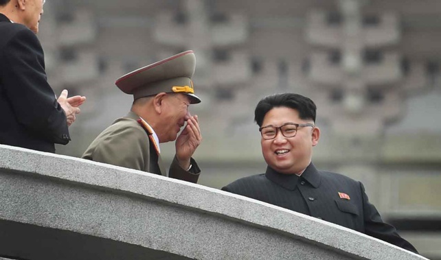 Kim Jong Un (right) seen last year at a military parade (Getty Images) 