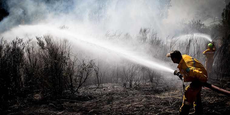 Firefighters tackle the Port Hills blaze last month (Supplied)