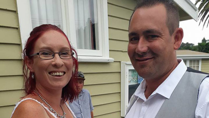 Nathaniel Blomfield and Mel Holmes tied the knot inside the local community hall, marooned by flooded farmland. (Supplied)