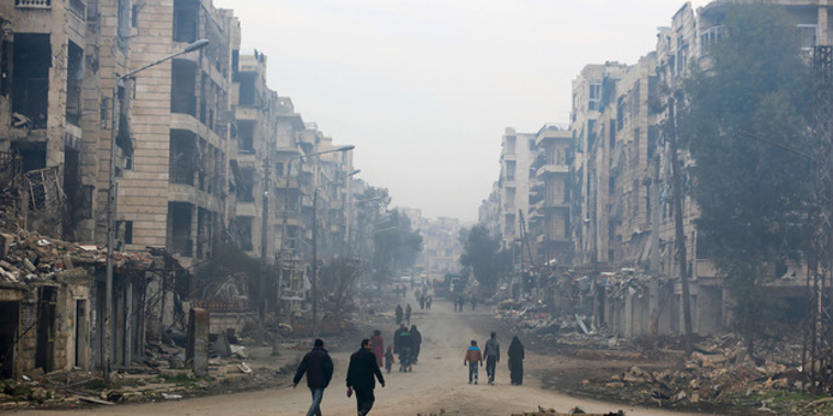 If you're one of the 10 million displaced people in the war ravaged Middle East, life is inconceivably miserable, writes Barry Soper. In this photo, residents walk through the destruction in the once rebel-held Salaheddine neighbourhood of eastern Aleppo, Syria. Photo / AP