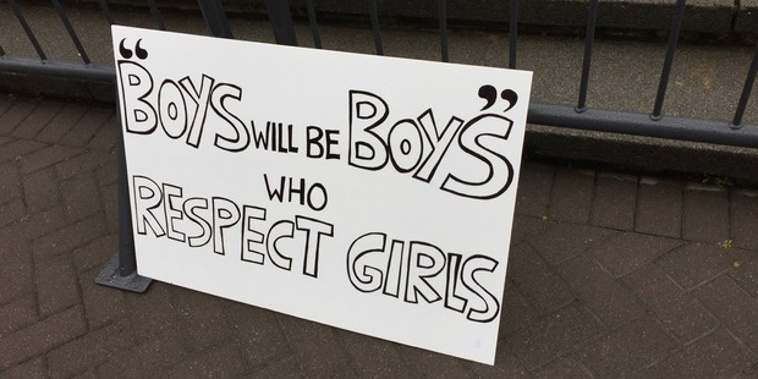 A sign at the rape culture protest in Wellington takes aim at the old saying: 'Boys will be boys'. (Melissa Nightingale)