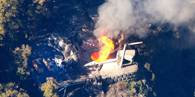 Flames leap from the ventilation shaft at the Pike River Mine. Photo / Mark Mitchell